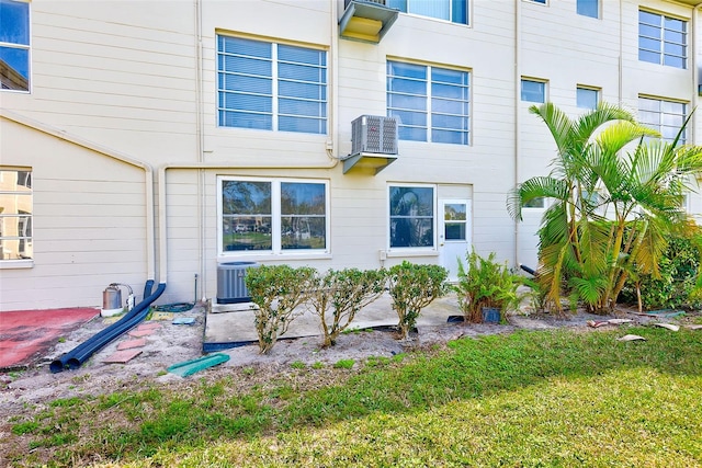 view of side of property with central AC