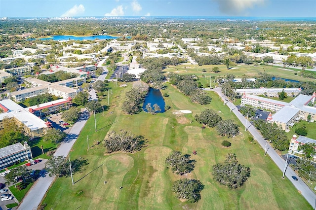 bird's eye view with view of golf course and a water view