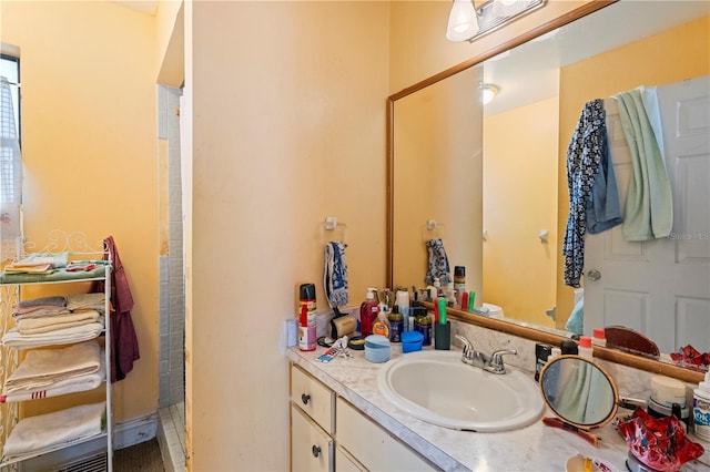 full bath with a walk in shower and vanity