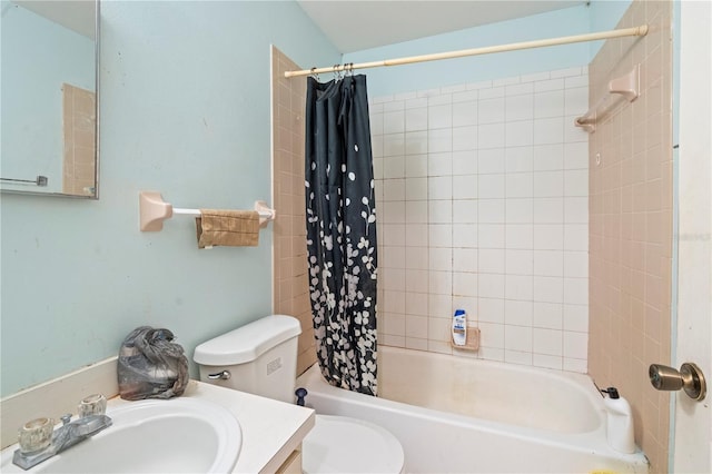 bathroom with vanity, toilet, and shower / bath combo with shower curtain