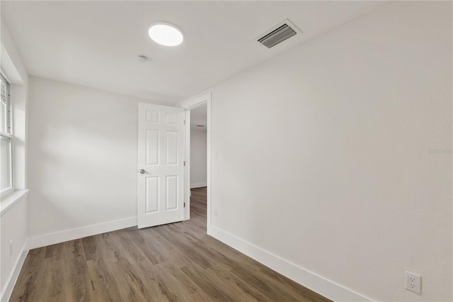 8319 N 14th St, Tampa, FL 33604 - empty room featuring wood finished floors and baseboards