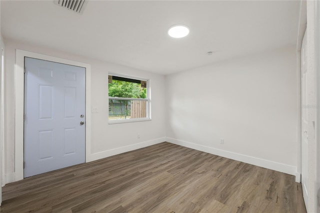 8319 N 14th St, Tampa, FL 33604 - spare room with wood finished floors and baseboards
