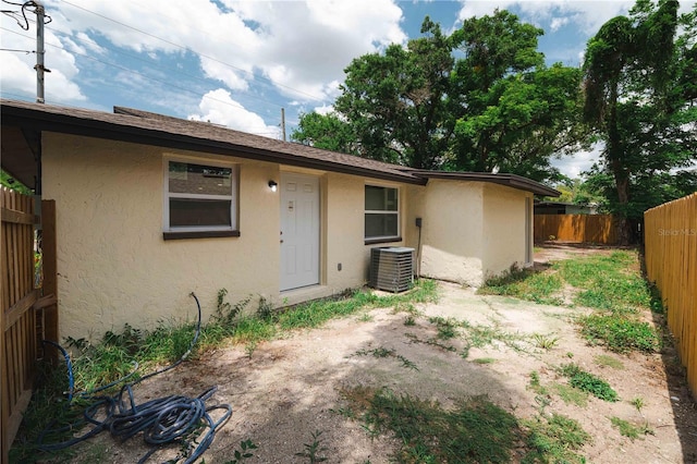 8319 N 14th St, Tampa, FL 33604 - view of front of home featuring stucco siding and central air condition unit