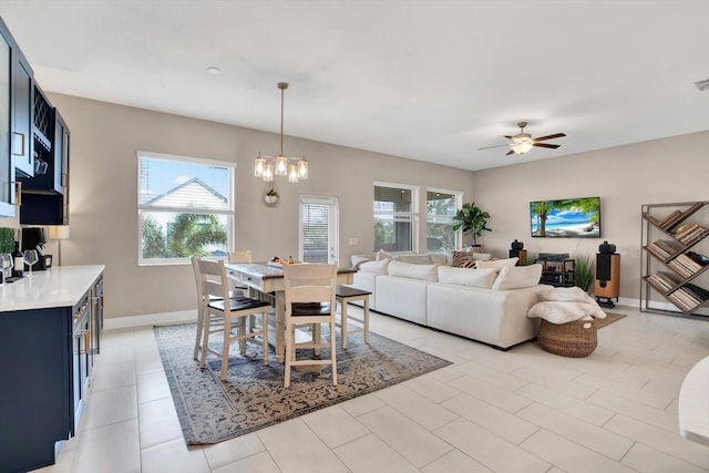 dining space featuring visible vents, baseboards, and ceiling fan with notable chandelier