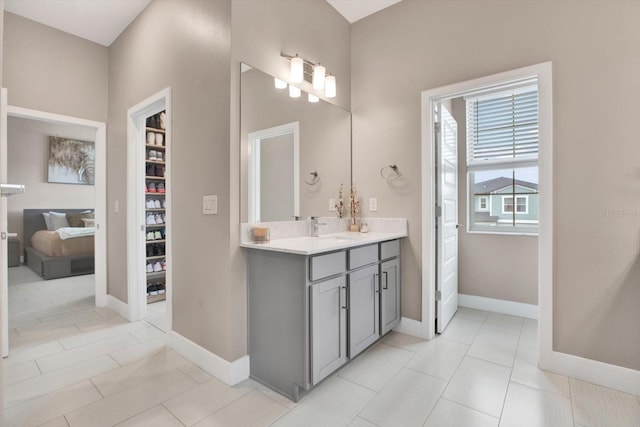 bathroom featuring vanity and baseboards