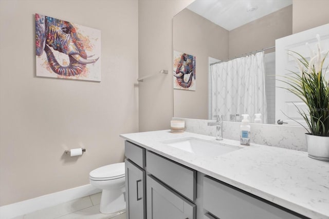 full bathroom featuring a shower with shower curtain, toilet, vanity, tile patterned flooring, and baseboards