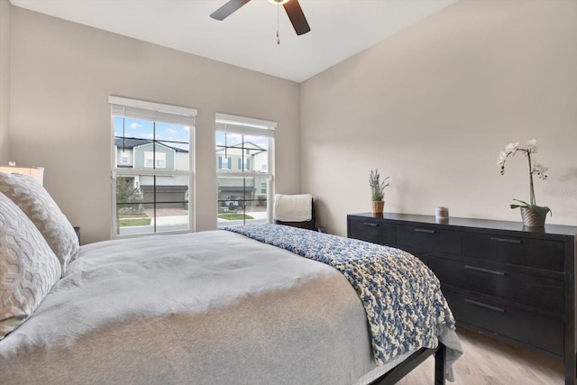 bedroom featuring light wood-style flooring and a ceiling fan