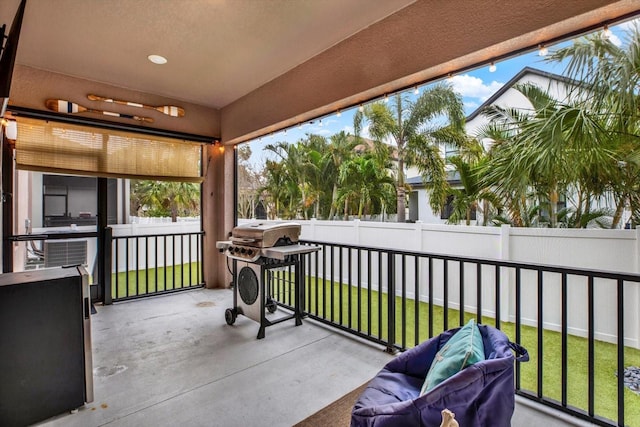 view of patio featuring a grill and a fenced backyard