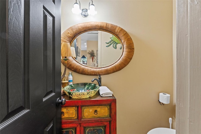 bathroom with toilet and vanity