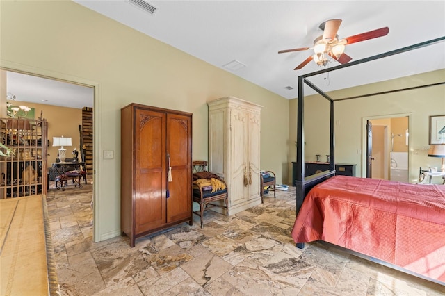 bedroom featuring ensuite bath, stone finish floor, a ceiling fan, and visible vents