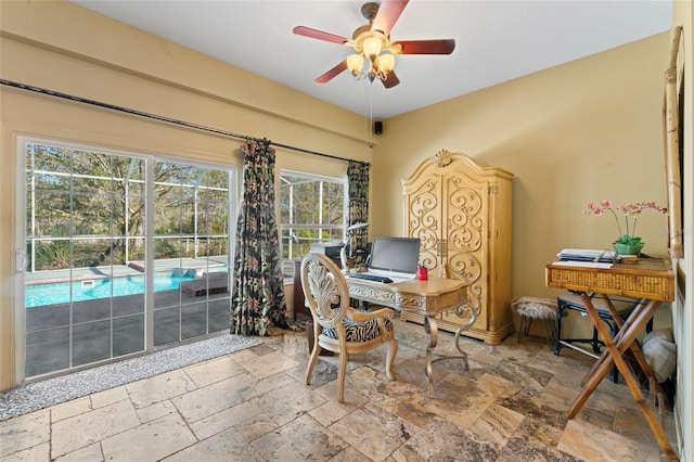 office with stone tile flooring and ceiling fan