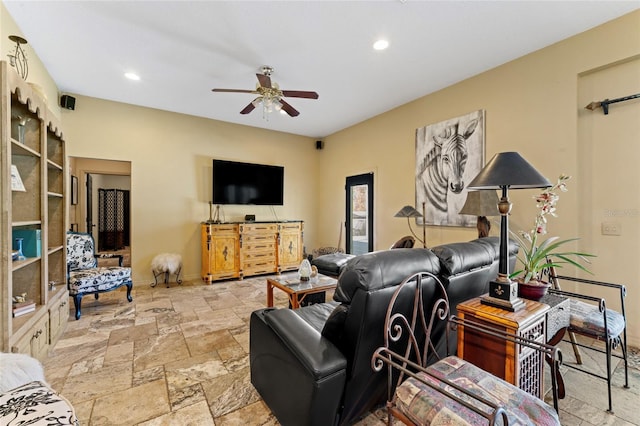 living room with recessed lighting, a ceiling fan, baseboards, and stone tile flooring