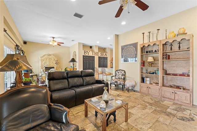 living area with stone tile flooring, visible vents, recessed lighting, and ceiling fan