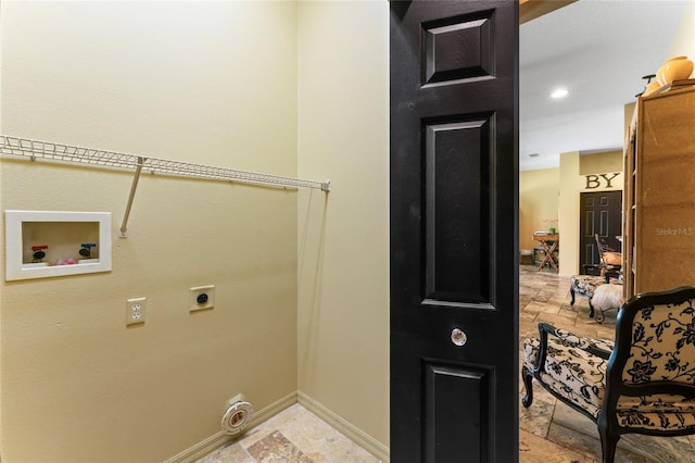 clothes washing area featuring stone tile floors, baseboards, hookup for an electric dryer, laundry area, and washer hookup