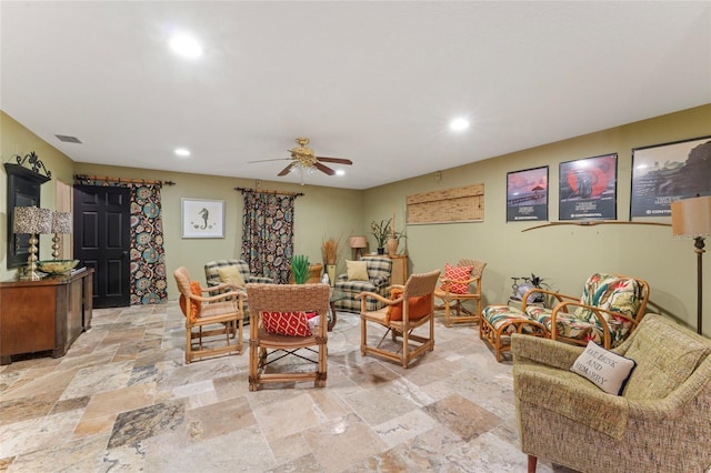 living room featuring stone tile floors, recessed lighting, and ceiling fan