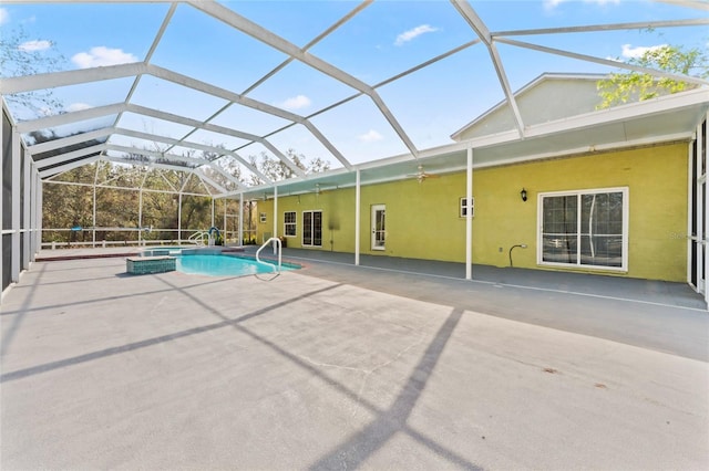 view of pool with a patio, a pool with connected hot tub, and a lanai