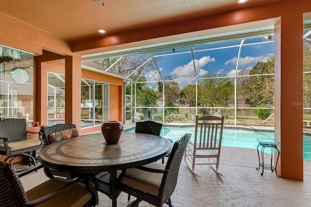 sunroom featuring a pool