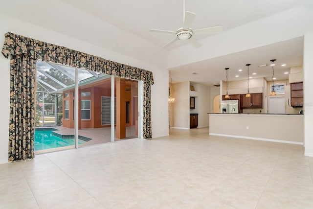 unfurnished living room featuring baseboards, ceiling fan, and recessed lighting