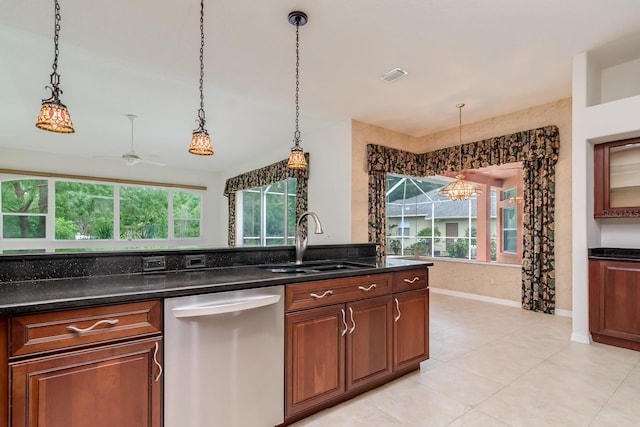 kitchen featuring stainless steel dishwasher, visible vents, a wealth of natural light, and a sink