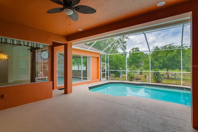 outdoor pool featuring a lanai, a patio, and ceiling fan