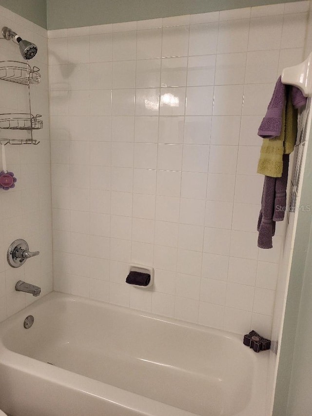 bathroom with shower / tub combination