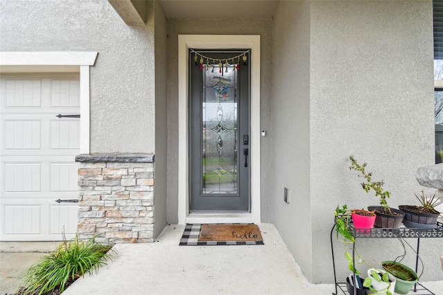 doorway to property with stucco siding