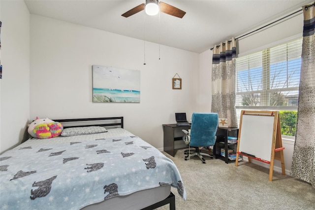 carpeted bedroom with a ceiling fan