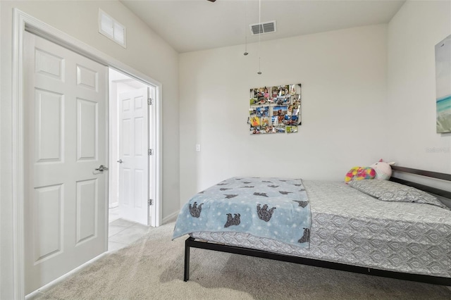 carpeted bedroom with visible vents