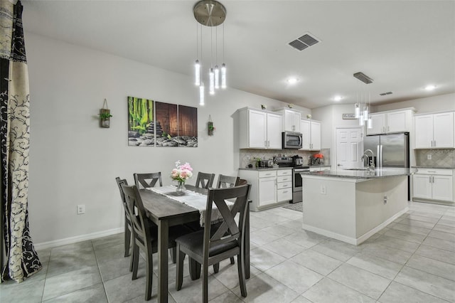 dining space featuring recessed lighting, visible vents, baseboards, and light tile patterned floors