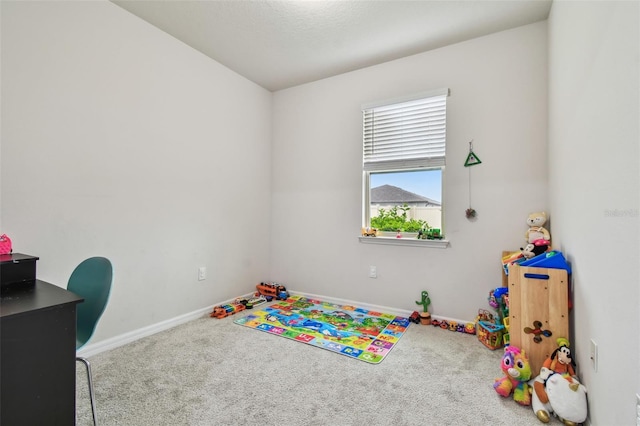 playroom featuring carpet and baseboards