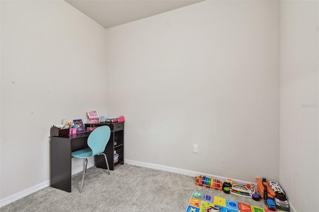 rec room featuring carpet floors and baseboards