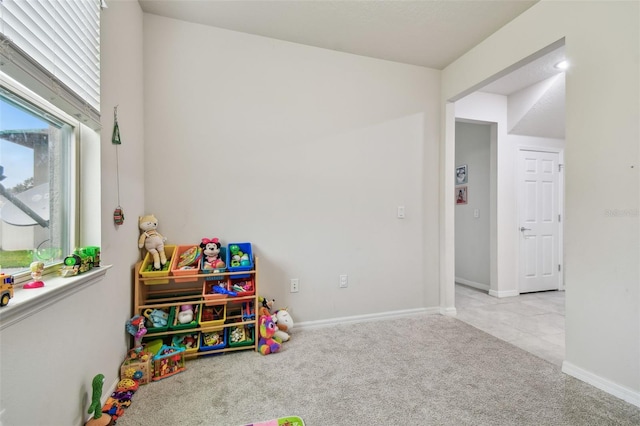 game room with carpet floors and baseboards