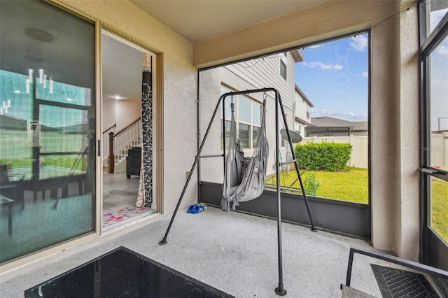 unfurnished sunroom with plenty of natural light