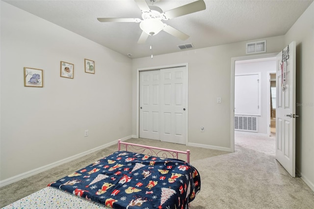 bedroom with baseboards, visible vents, and carpet flooring