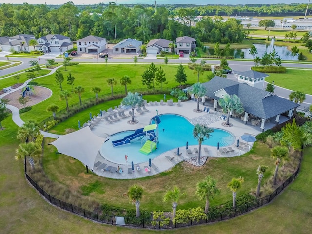 birds eye view of property with a residential view