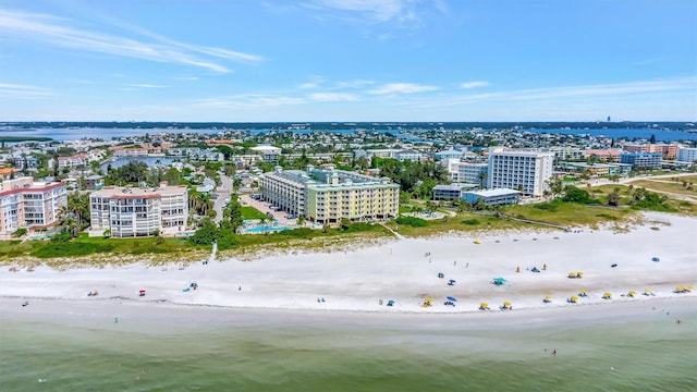 drone / aerial view with a view of city, a water view, and a beach view