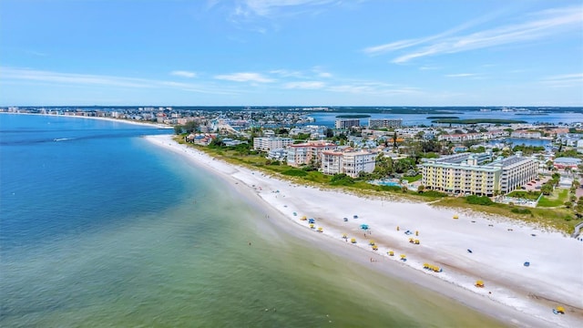 bird's eye view featuring a city view, a water view, and a beach view