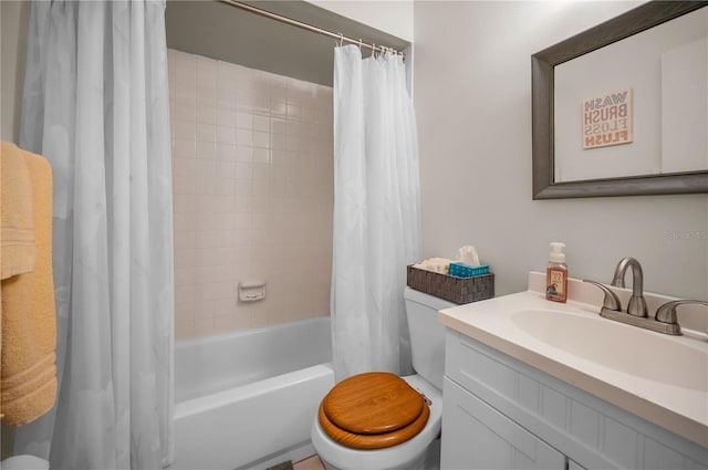 full bath featuring shower / bath combo, vanity, and toilet