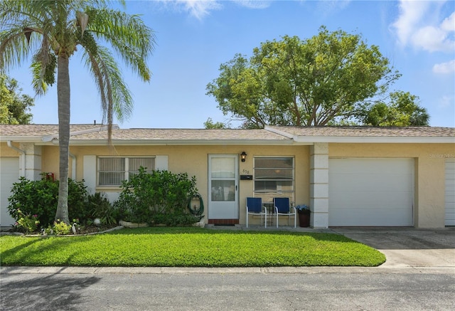 858 Cambridge Ct Unit 858, Dunedin, FL 34698 - single story home featuring stucco siding, concrete driveway, an attached garage, and a front yard