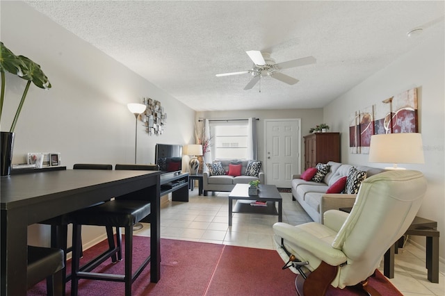 858 Cambridge Ct Unit 858, Dunedin, FL 34698 - tiled living room featuring ceiling fan and a textured ceiling