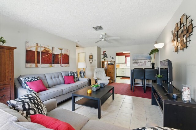 858 Cambridge Ct Unit 858, Dunedin, FL 34698 - living area with ceiling fan and a textured ceiling