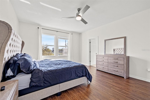 bedroom with baseboards, wood finished floors, and a ceiling fan