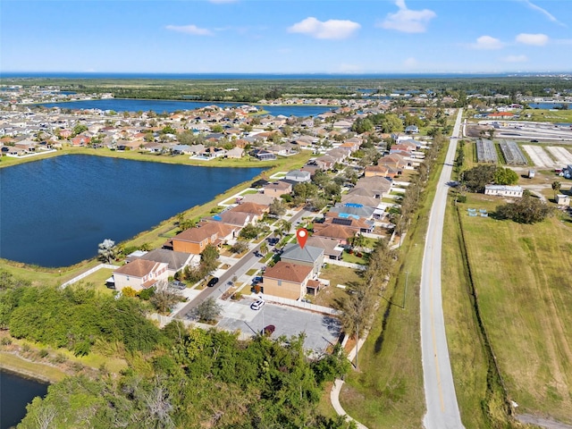 bird's eye view with a residential view and a water view