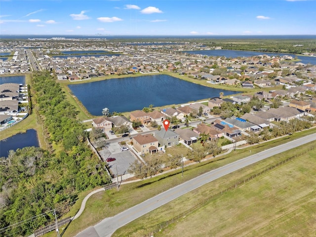 birds eye view of property with a residential view and a water view