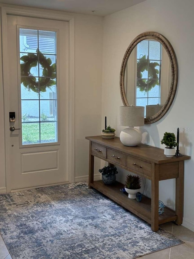 entryway featuring light tile patterned floors