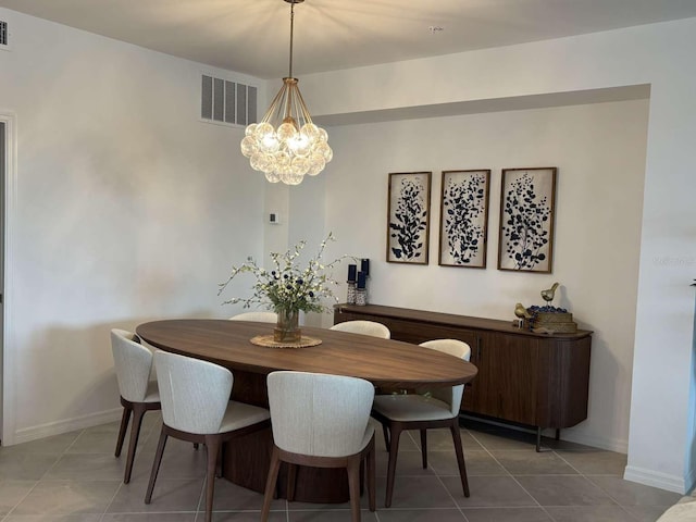 tiled dining room with a notable chandelier, visible vents, and baseboards