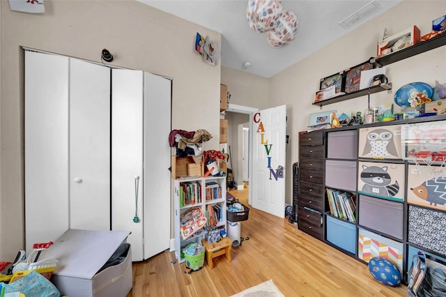 interior space featuring light wood-type flooring and visible vents