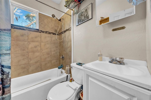 full bathroom with toilet, a textured wall, shower / bath combo, and vanity