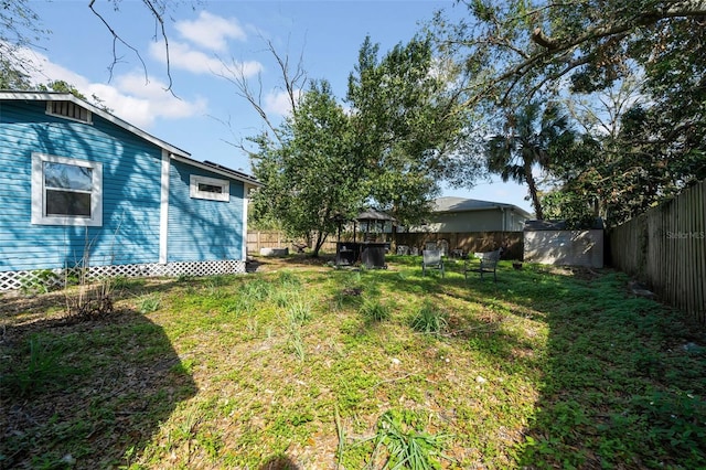 view of yard with a fenced backyard