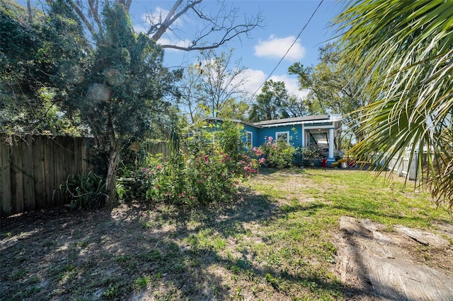 view of yard with a fenced backyard